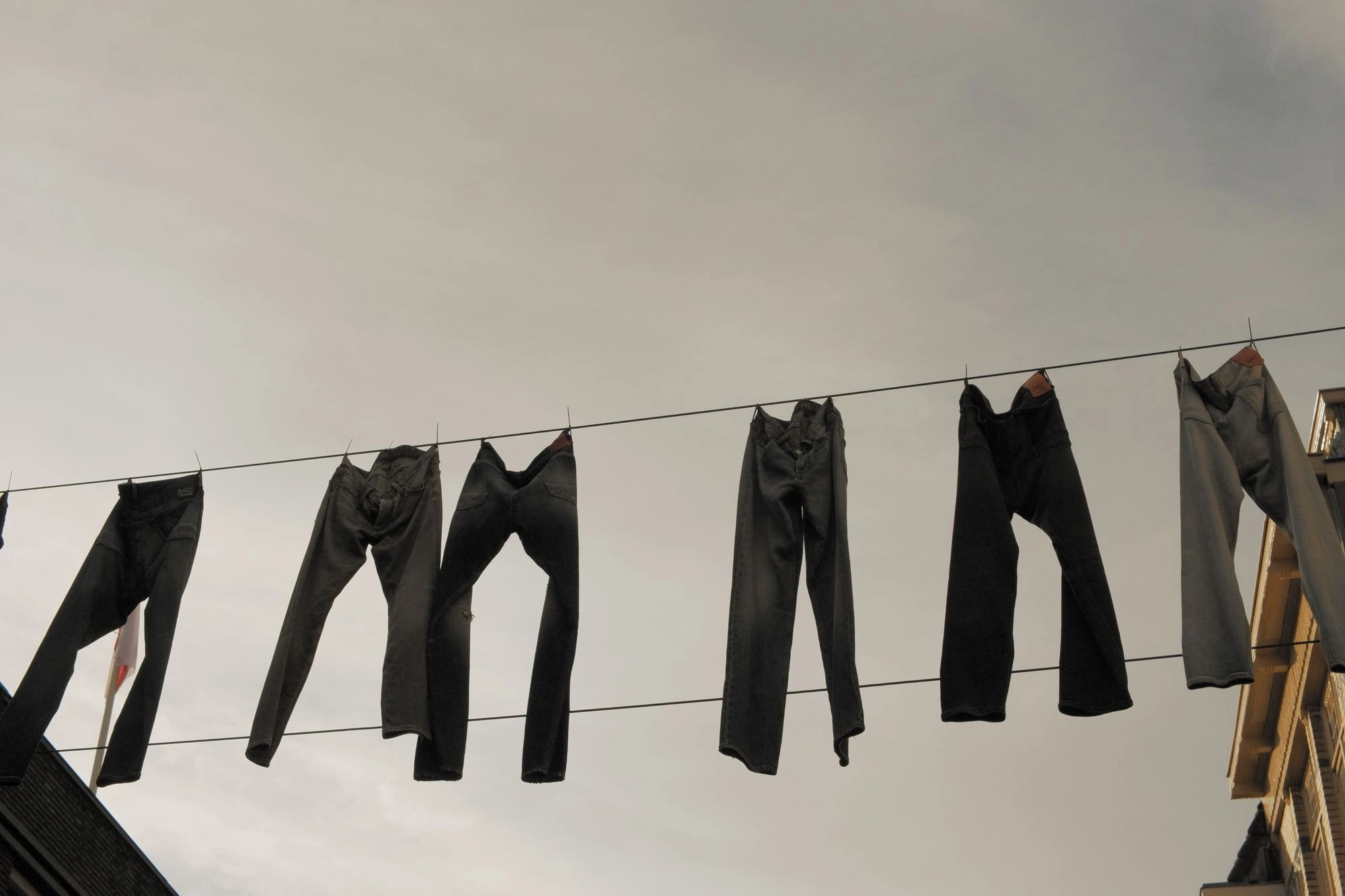 2026-05-31 - xt35 - color - NL - Utrecht - Jeans hanging between the buildings