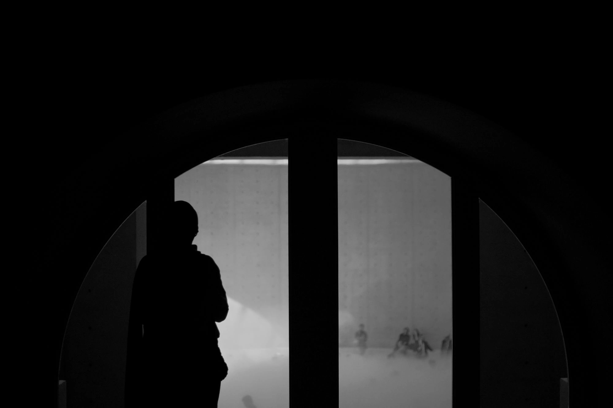 2026-07-06 - xt35 - bw - FR - Paris - Summer in Paris - Person standing in front of window in shadow
