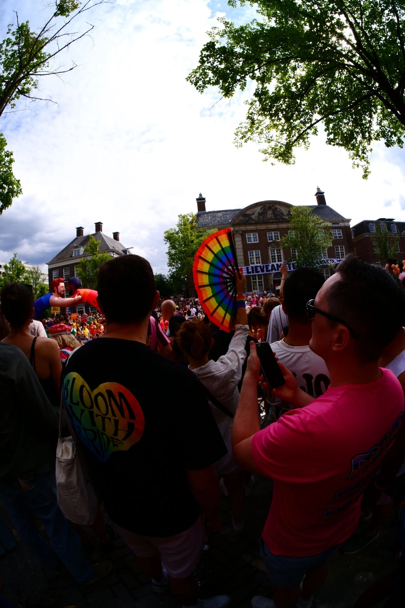 2026-08-01 - xt7.5 - color - NL - Amsterdam - Person waving a giant rainbow fan