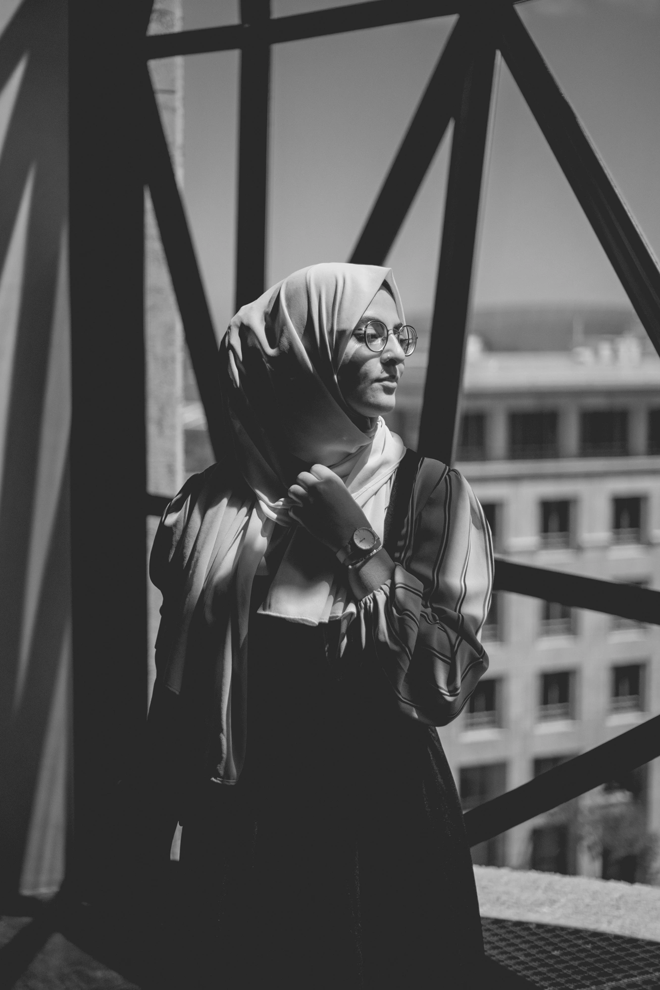 2022-02-16 - xt35 - bw - ZA - Cape Town - Person standing beside geometric windows