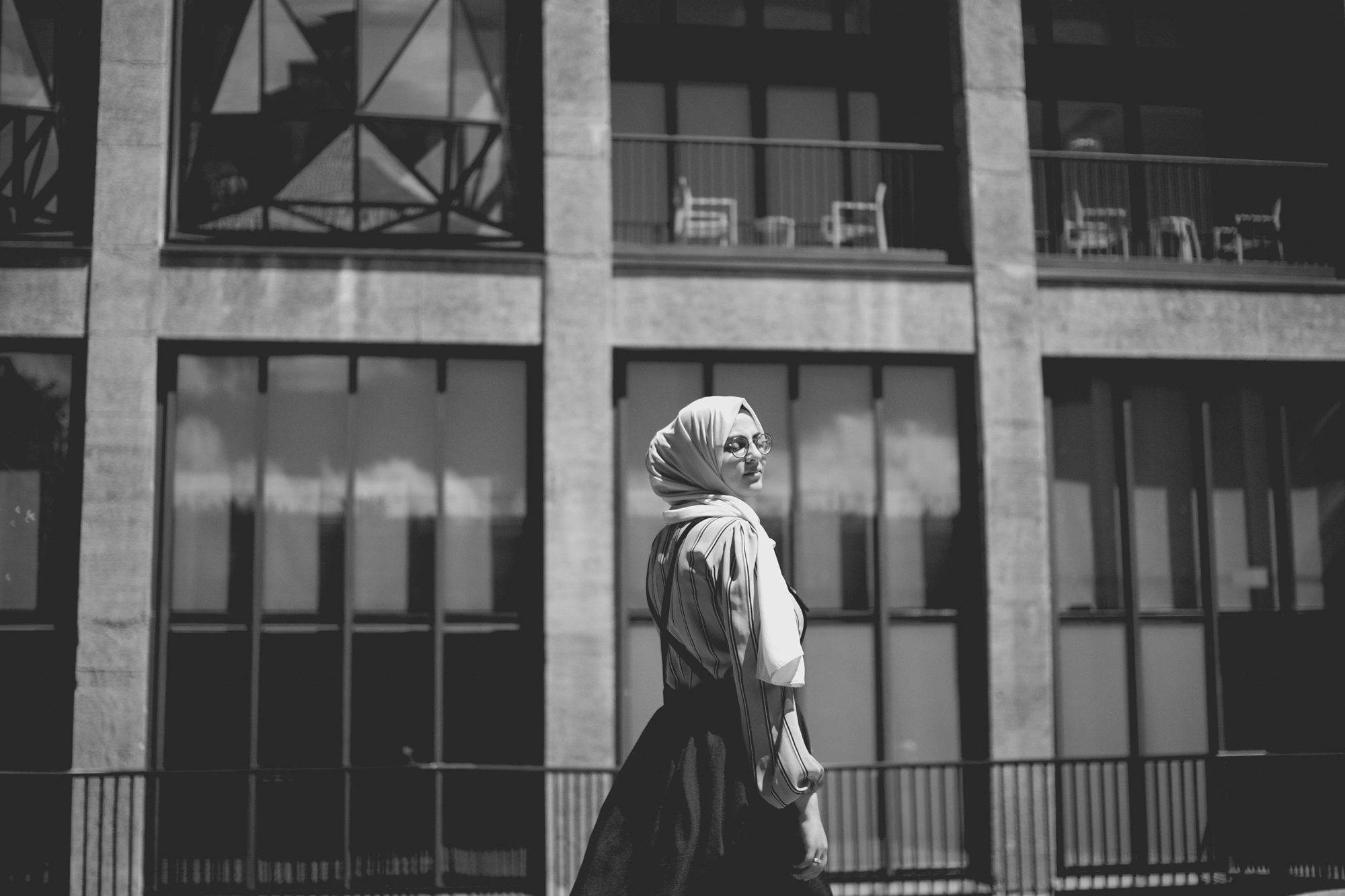 2022-02-16 - xt35 - bw - ZA - Cape Town - Person stands in front of building