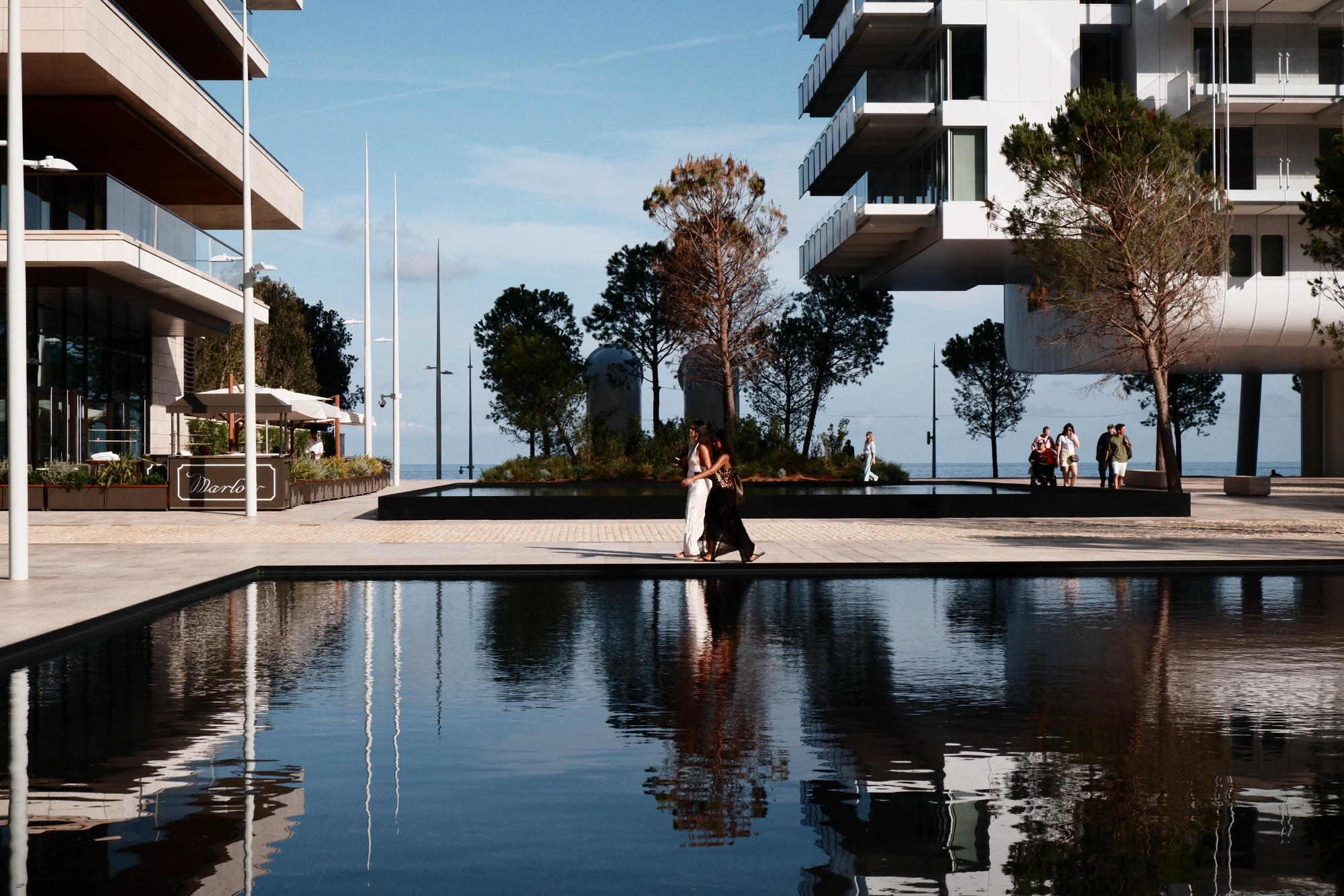 2025-09-08 - xt15-45 - color - MC - Monte Carlo - People walking next to pool